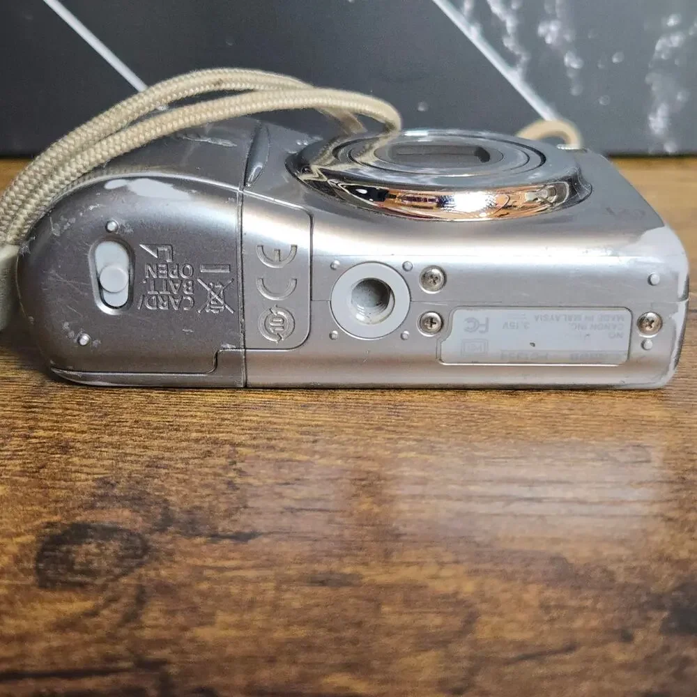 Canon PowerShot A1100 IS 12.1MP CCD Digital Camera Silver Tested Working